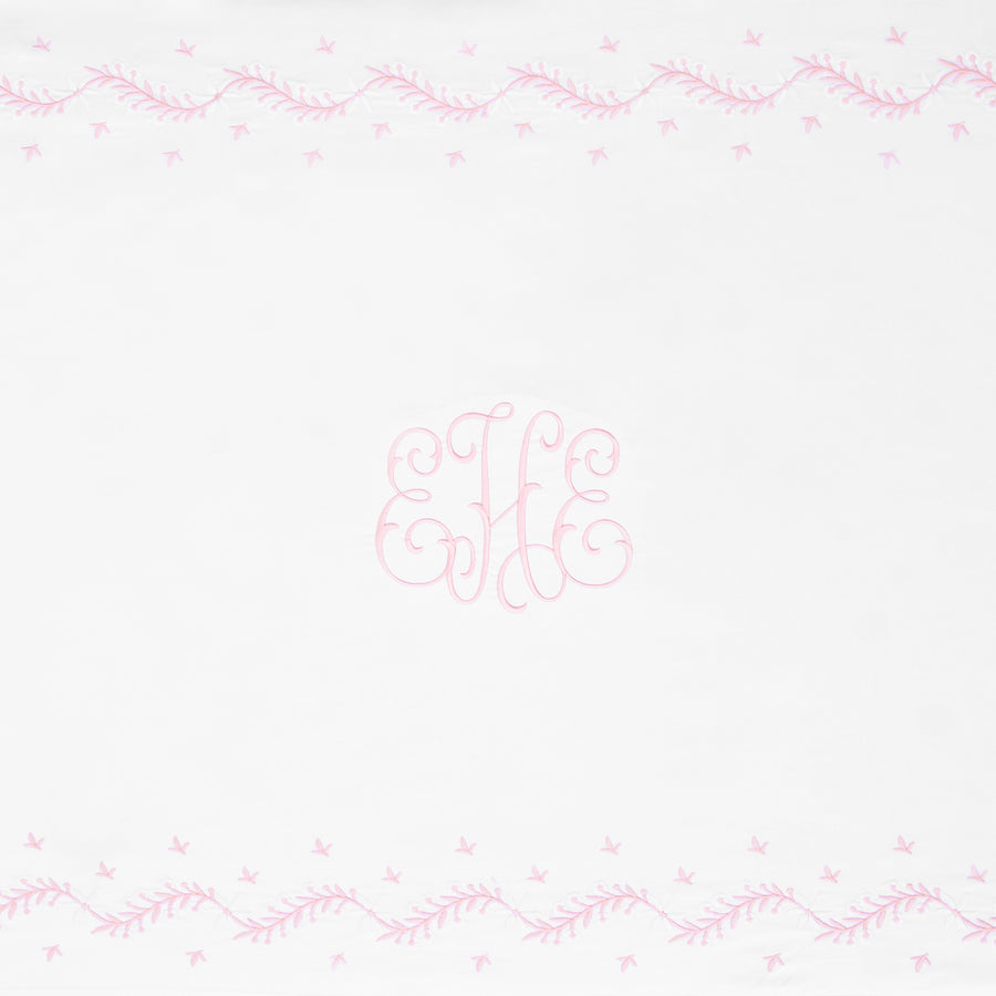 Little English classic nursery goods for baby, white crib sheet with simple light pink embroidery along the edges for baby