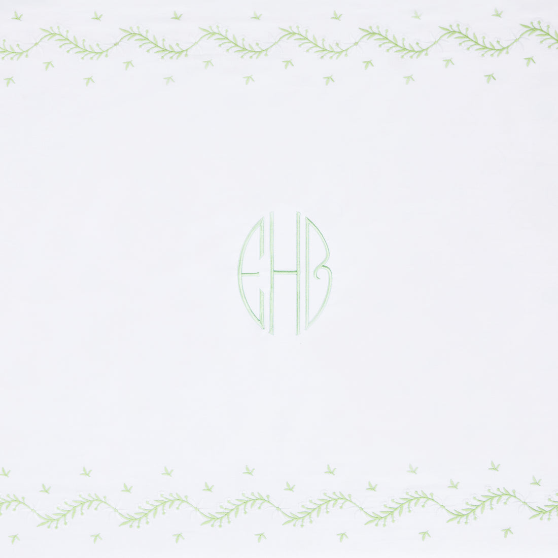 Little English classic nursery goods for baby, white crib sheet with simple light green embroidery along the edges for baby