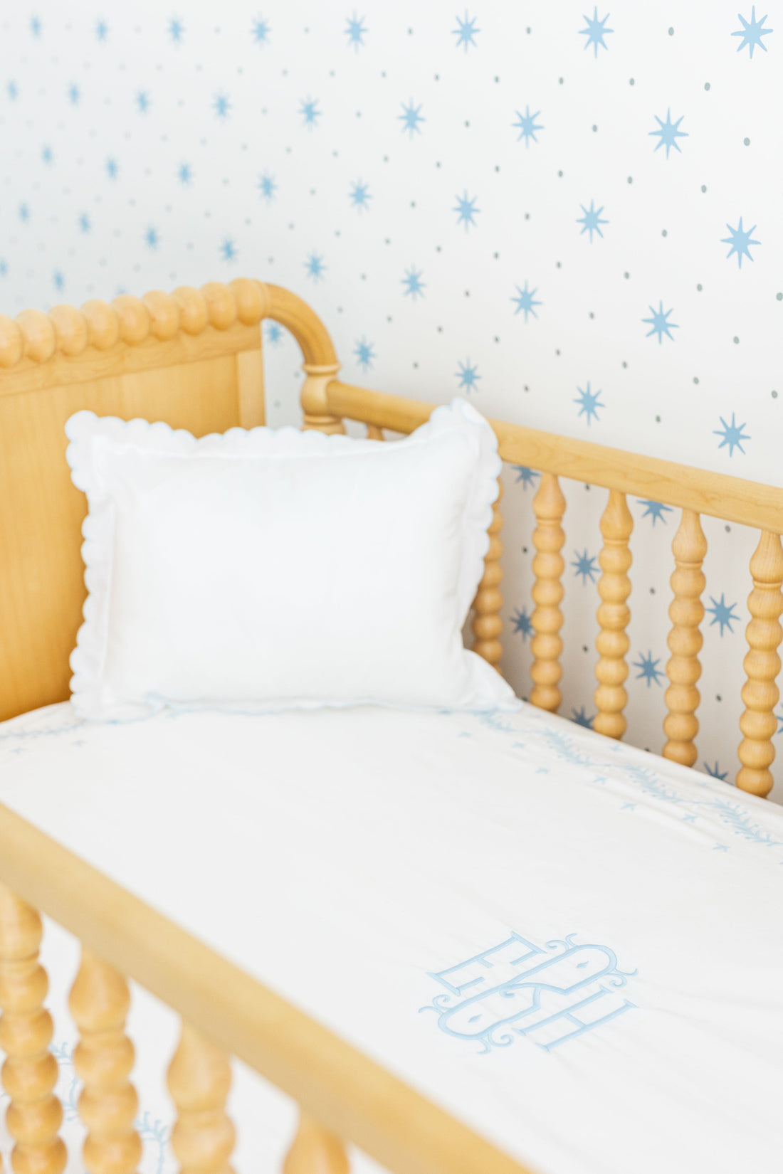 Little English classic nursery goods for baby, white crib sheet with simple light blue embroidery along the edges for baby