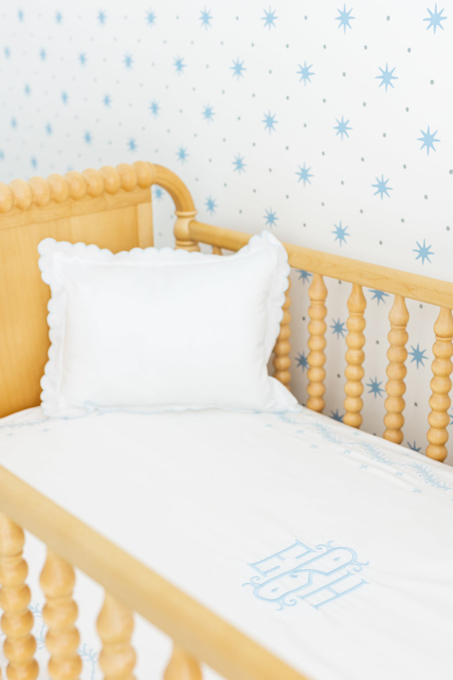Little English classic nursery goods for baby, white crib sheet with simple light blue embroidery along the edges for baby