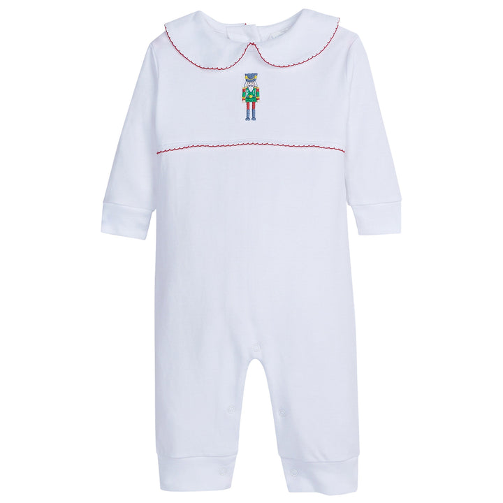 Little English boys white long sleeved playsuit with red trim and nutcracker embroidery on chest