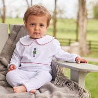 Little English boys white long sleeved playsuit with red trim and nutcracker embroidery on chest