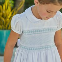 Little English traditional girl's clothing, classic smocked dress for toddler girls with peter pan collar and sash, little girl's flower girl dress with light blue smocking