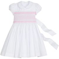 Little English traditional girl's clothing, classic smocked dress for toddler girls with peter pan collar and sash, little girl's flower girl dress with light pink smocking