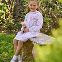 Little English traditional children's clothing. Long sleeve pink and green Windemere floral dress with ruffled collar and fixed bow detail for little girls