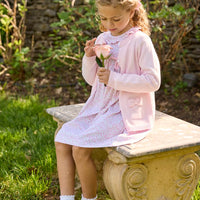 Little English traditional children's clothing. Long sleeve pink and green Windemere floral dress with ruffled collar and fixed bow detail for little girls.  Layered with light pink bow pocket cardigan.