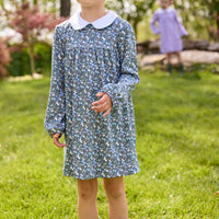 Little English traditional children's clothing. Long sleeve blue and green Winslow Floral cotton knit dress with white peter pan collar and blue piping detail for little girls.
