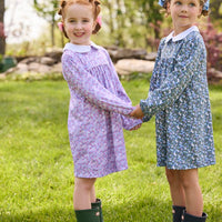 Little English traditional children's clothing. Long sleeve blue and green Winslow Floral cotton knit dress with white peter pan collar and blue piping detail for little girls. Long sleeve pink, blue, and lavender Ashbrook Floral cotton knit dress with white peter pan collar and pink piping detail.