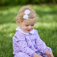 Little English traditional children's clothing. Long sleeve pink, blue, and lavender Ashbrook Floral cotton knit romper with white peter pan collar and pink piping detail for baby girls.