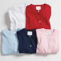 Little English traditional children's clothing. Essential cardigans in red, navy, light blue, light pink, and white