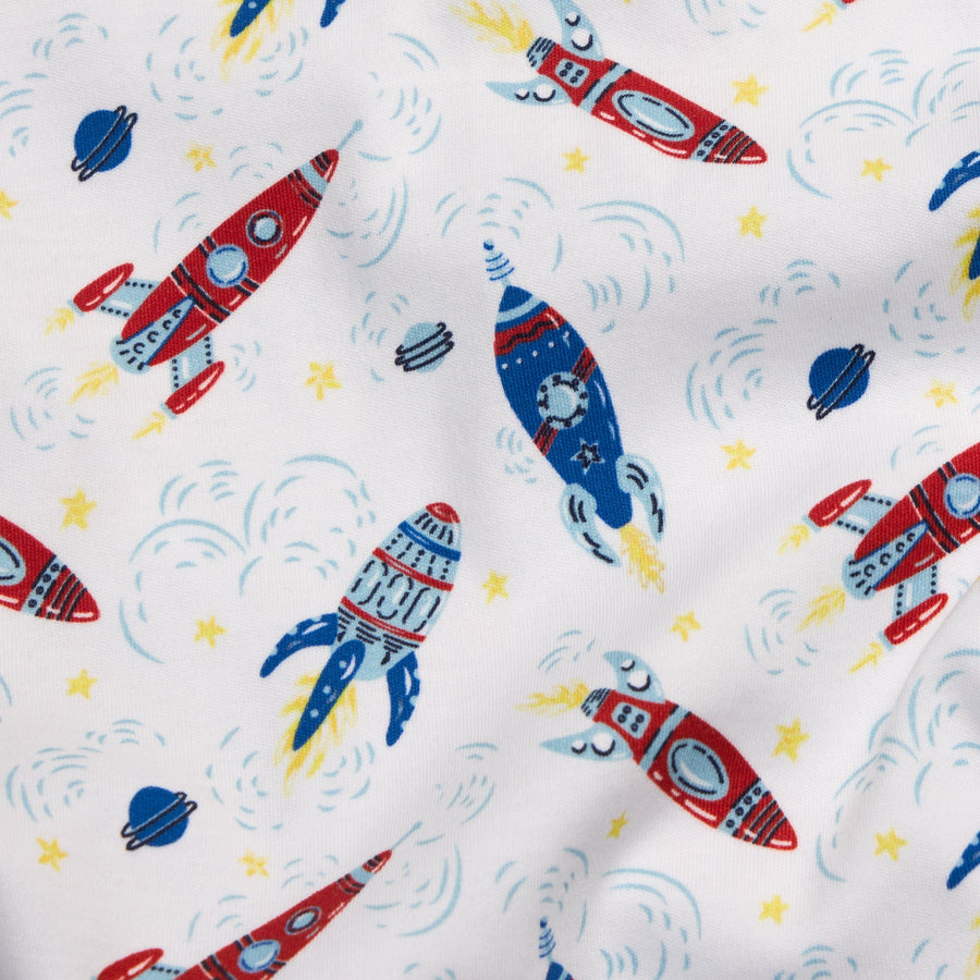 Little English classic children's clothing blue, red, and yellow all over rocket ship print 