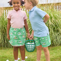 Little English traditional children's clothing.  Classic green twill skort with golf cart print and pink trim for girls.