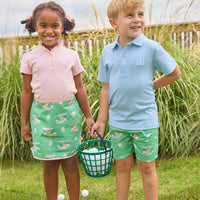Little English traditional children's clothing.  Classic green twill skort with golf cart print and pink trim for girls.