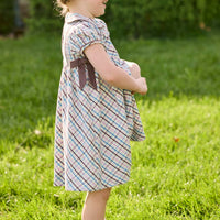 Little English traditional children's clothing. Short sleeve peter pan dress in blue, pink, and brown Wilmington Plaid with brown corduroy piping and bow details for little girls.