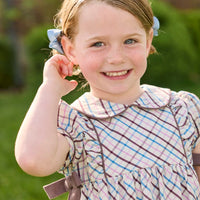 Little English traditional children's clothing. Short sleeve peter pan dress in blue, pink, and brown Wilmington Plaid with brown corduroy piping and bow details for little girls.