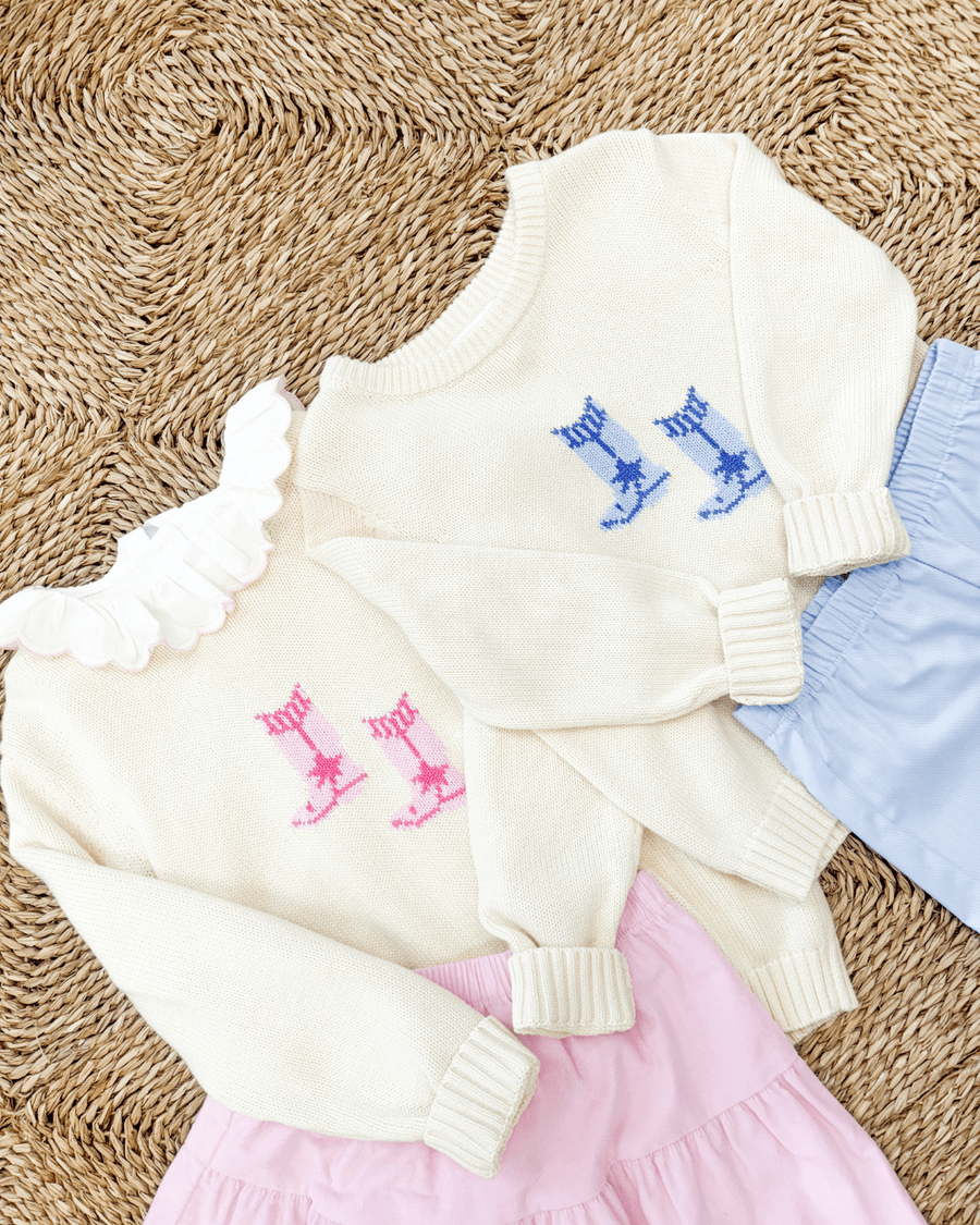 Little English cream intarsia sweaters with cowboy boots in pink and blue