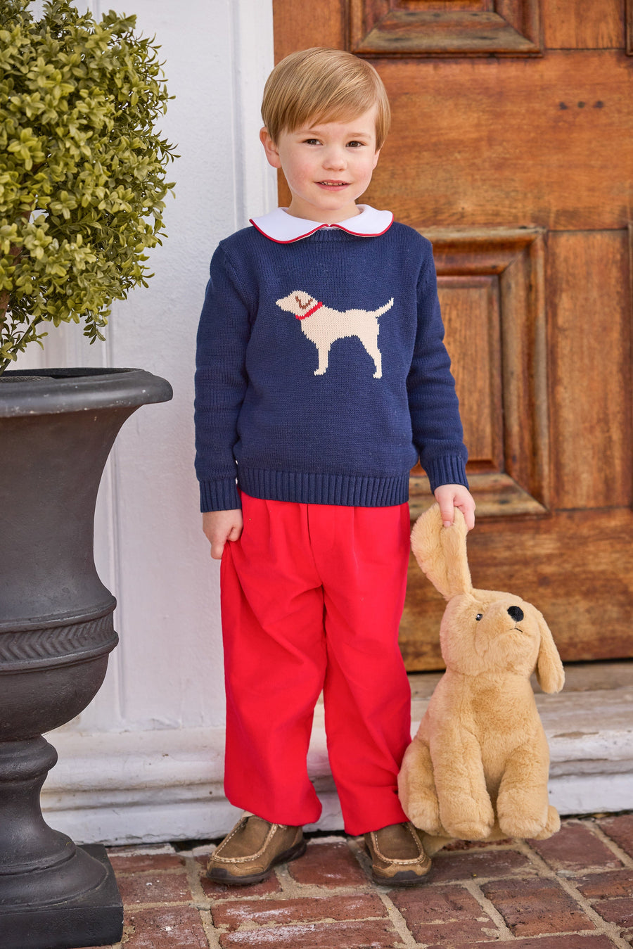 little english classic children's clothing boys navy sweater with cream lab motif, red piped peter pan shirt, and red banded corduroy pant for fall 