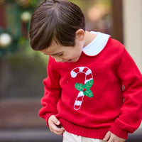 Little English traditional children's clothing. Red Intarsia Sweater with candy cane motif for boys and girls layered over red piped white knit peter pan shirt and khaki pebble twill banded pants.