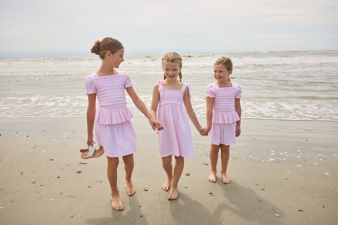 Little English classic isla top in jaipur pink with smocked details, isla skirt in jaipur pink, Leela dress with tie shoulders in jaipur pink, for little girls