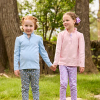 Little English traditional children's clothing.  Long sleeve Hastings polo in light pink with ruffle collar and purple floral detailing. Paired with Purple floral leggings for little girls.  Light blue Hastings polo with green floral detail paired with green floral leggings.