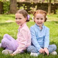 Little English traditional children's clothing.  Long sleeve Hastings polo in light pink with ruffle collar and purple floral detailing. Paired with Purple floral leggings for little girls.  Light blue Hastings polo with green floral detail paired with green floral leggings.