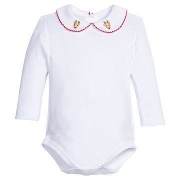 Little English traditional children's clothing.  White knit onesie for baby boy with red picot trim and pinpoint reindeer on the peter pan collar