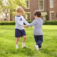 Little English traditional children's clothing.  Light blue and navy Winslow Stripe long sleeve polo shirt paired with navy essential jogger.  Light blue stripe long sleeve applique t-shirt with football and helmet applique paired with navy twill basic shorts.