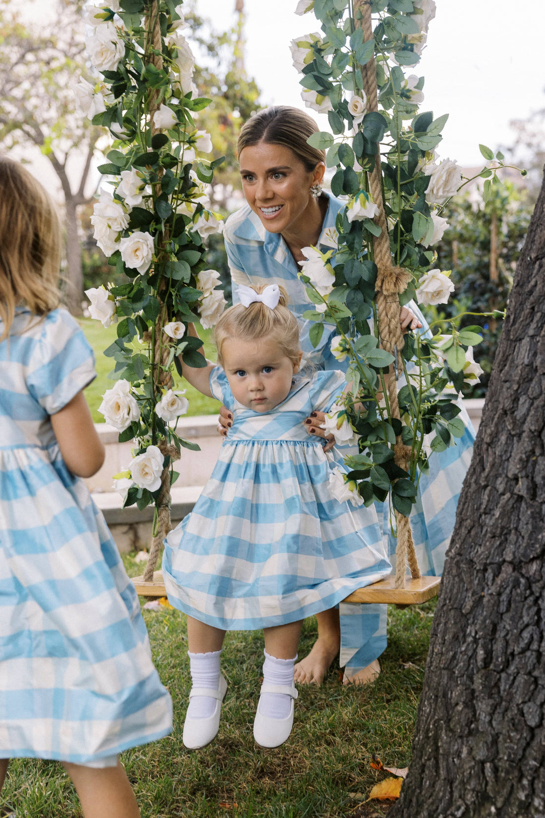 Little English X Luciana Emilia Capsule Collection special occasion dress for little girls.  Formal dress in 100% silk blue check with peter pan collar and capped sleeves