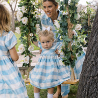 Little English X Luciana Emilia Capsule Collection special occasion dress for little girls.  Formal dress in 100% silk blue check with peter pan collar and capped sleeves