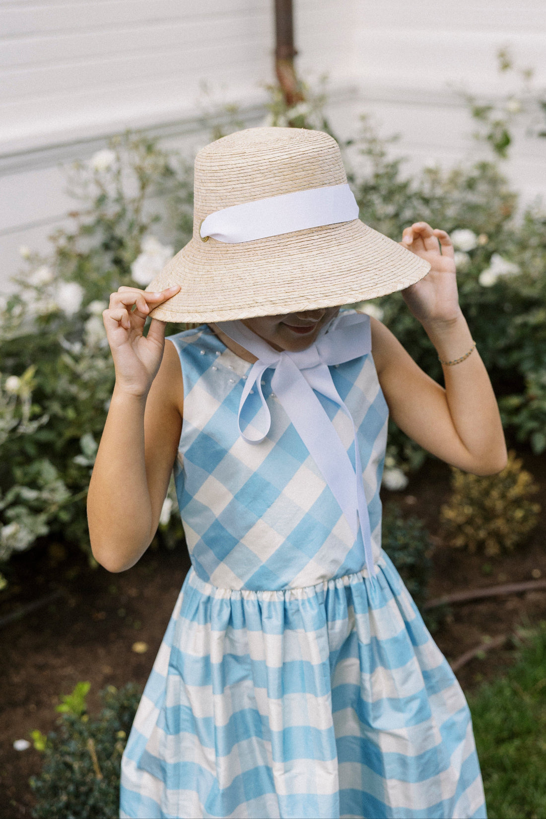 Heirloom quality, 100% silk, sleeveless light blue check formal dress with pearl details at neckline.  Little English X Luciana Emilia capsule collection special occasion dress for girls.