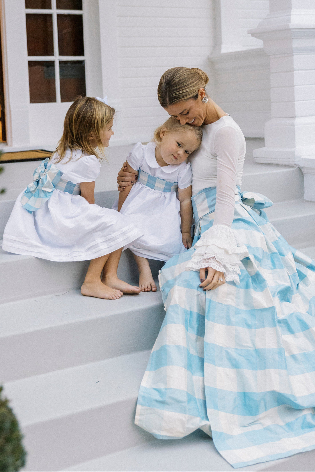 Little English X Luciana Emilia capsule collection bow sash in 100% silk blue check.  Special occasion dress accessory for girls paired with white peter pan formal dress