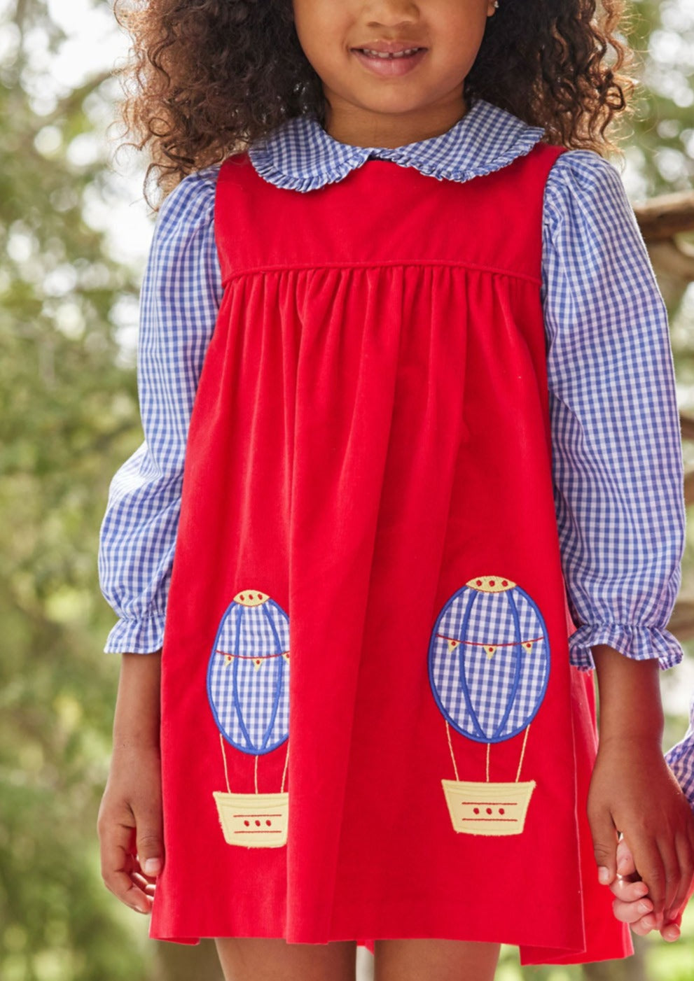 Little English classic toddler girl set with a ruffle collar peter pan shirt and a red jumper with hot air balloon embroidery at the bottom