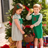 Little English Classic Children's clothing Marisa Dress in mistletoe tartan print with green bow on chest, peter pan shirt in mistletoe tartan, button tab john john in evergreen corduroy, boys and girls winter styles for the holiday season, coordinating outfits