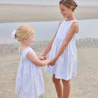 Little English traditional children's clothing.  Light blue and white striped sleeveless dress with white ricrac trim for little girls