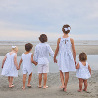 Little English traditional children's clothing.  Light blue and white Savannah Stripe sleeveless dress with white bow tie in back for little girls
