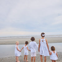 Little English traditional children's clothing.  Light blue and white striped sleeveless dress with white ricrac trim for little girls