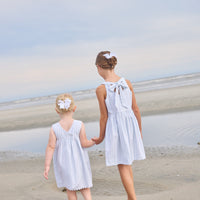 Little English traditional children's clothing.  Light blue and white striped sleeveless dress with white ricrac trim for little girls