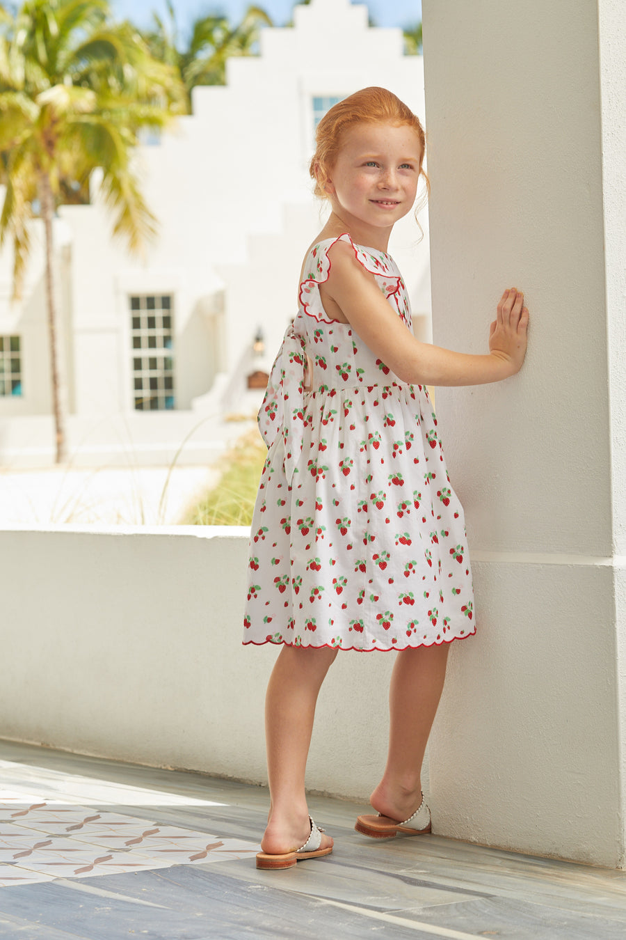 Little English traditional children’s clothing, girl's cotton dress in strawberry print with red piped ruffle sleeves for Spring