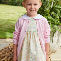 Little English girl's yellow floral spring dress with light pink cardigan