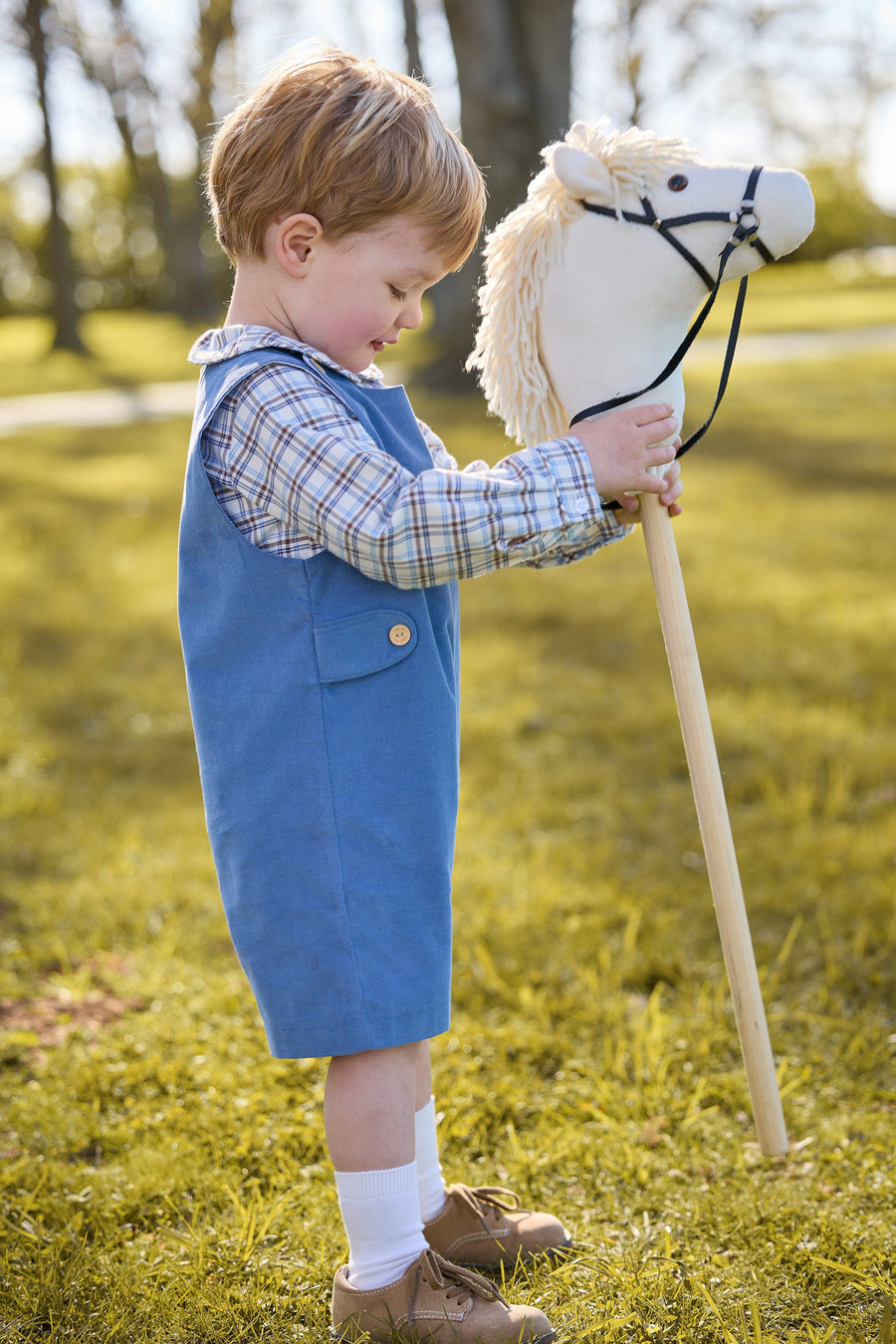 little english classic children's clothing peter pan collar long sleeve shirt in light blue, cream, and brown plaid, button tab john john in stormy blue, fall outfits for boys