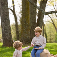 Little English traditional children's clothing.  Tan and blue Durham Windowpane peter pan shirt for toddler boys paired with stormy blue corduroy pull on pants. Older boy in stormy blue corduroy classic pants and Durham Windowpane button down shirt