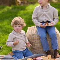 Little English traditional children's clothing.  Tan and blue Durham Windowpane peter pan shirt for toddler boys paired with stormy blue corduroy pull on pants. Older boy in stormy blue corduroy classic pants and Durham Windowpane button down shirt