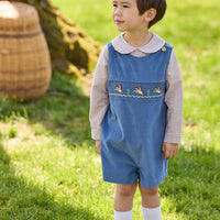 Little English traditional children's clothing.  Khaki Gingham peter pan shirt for toddler boys paired with stormy blue corduroy john john with flying mallard smocking across chest. 