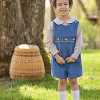 Little English traditional children's clothing.  Khaki Gingham peter pan shirt for toddler boys paired with stormy blue corduroy john john with flying mallard smocking across chest. 