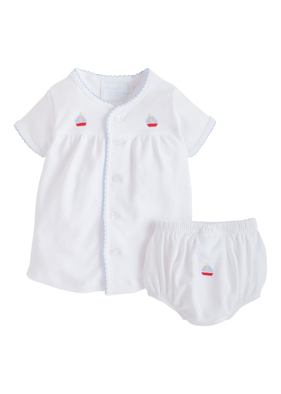 Little English traditional baby clothing.  Classic white pima cotton set with blue and red sailboat embroidery and light blue picot trim for baby boy