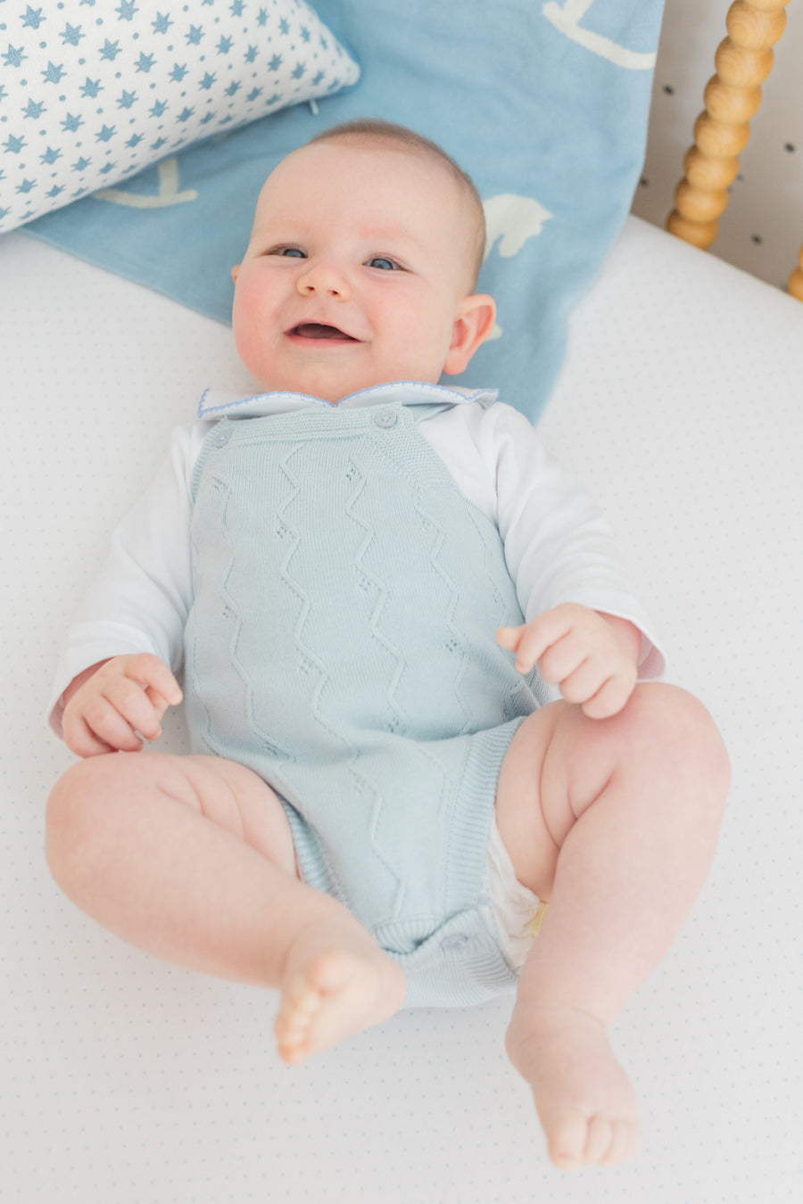 little english classic children's clothing baby boys light blue pointelle knit bubble with pinpoint onesie with rocking horse motif. Pima crib sheet in blue micro dot, for baby boy