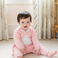 Little English traditional children's clothing. Long sleeve and long pant light pink pointelle sweater set accompanied by a picot peter pan onesie with light pink trim for baby girl