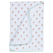 little english classic childrens clothing printed blanket with brown footballs on green grass with green picot trim
