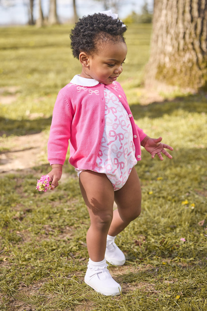 little english classic children's clothing baby girls essential cardigan in hot pink with embroidered white bows around neck,  long sleeve bubble with all over pink bows print with peter pan collar, fall outfit for girls