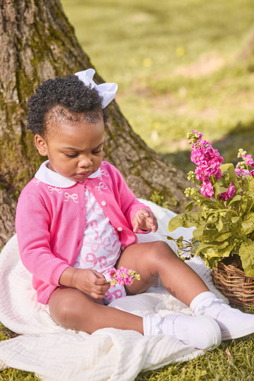 little english classic children's clothing baby girls essential cardigan in hot pink with embroidered white bows around neck,  long sleeve bubble with all over pink bows print with peter pan collar, fall outfit for girls